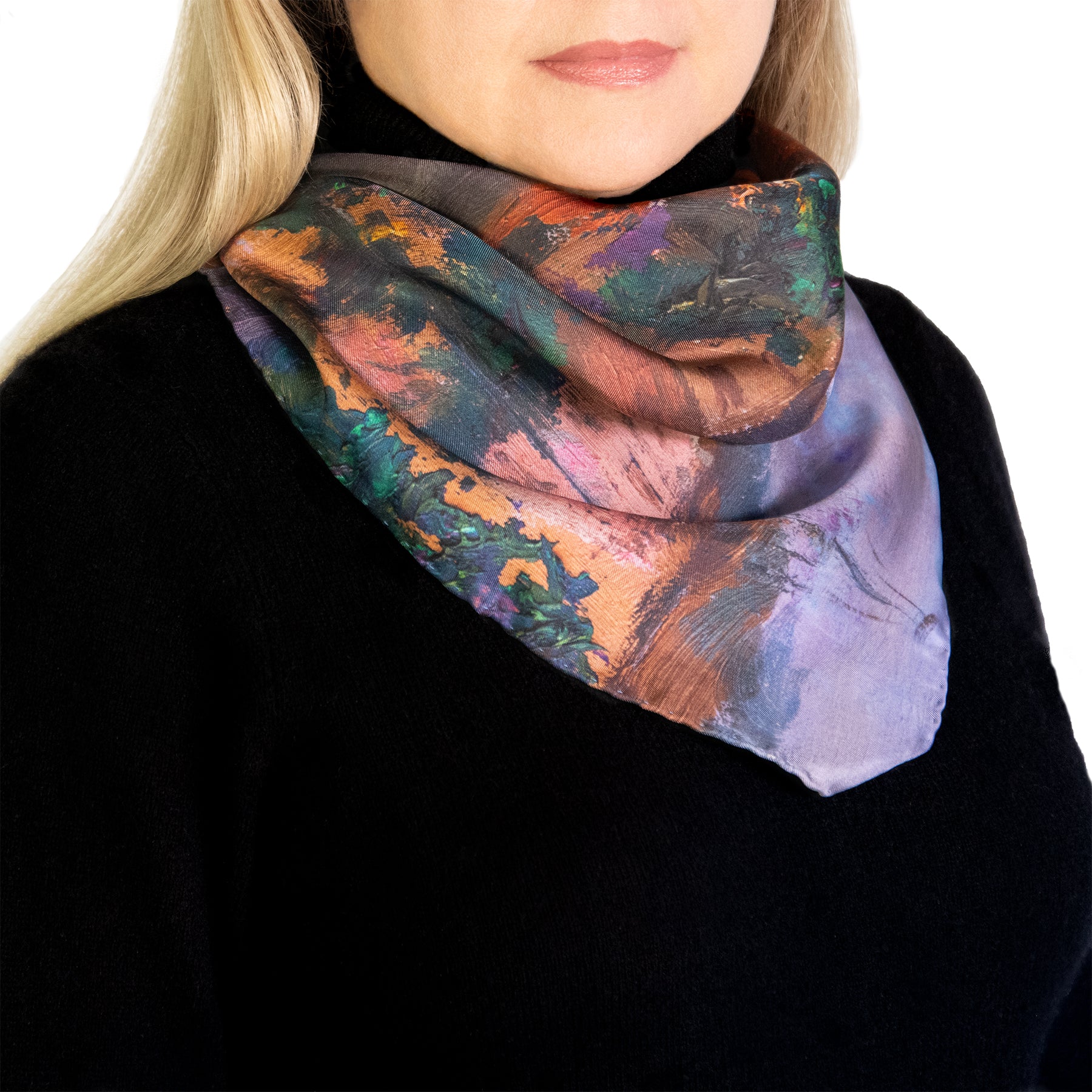 Twilight Reflections scarf showing orange and evening colors worn by model. 
