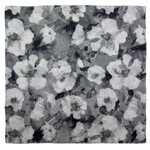 Square scarf with floral pattern in black, white, and gray overlapping images, hand hemmed edges. 
