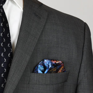 Lights of the City 16.5-inch San Francisco silk scarf styled as a men's pocket square with gray suit and blue tie